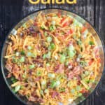 image of prepared recipe for Pinterest with text overlay title Cornbread Salad