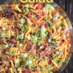 image of prepared recipe for Pinterest with text overlay title Cornbread Salad