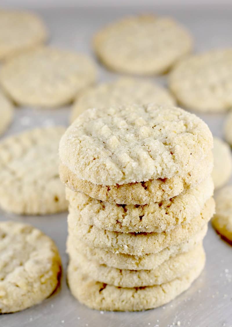 potato chip cookies stacked in a little tower on a metal bake sheet