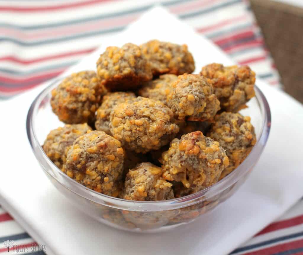 Sausage Balls in a clear plastic bowl over white napkin