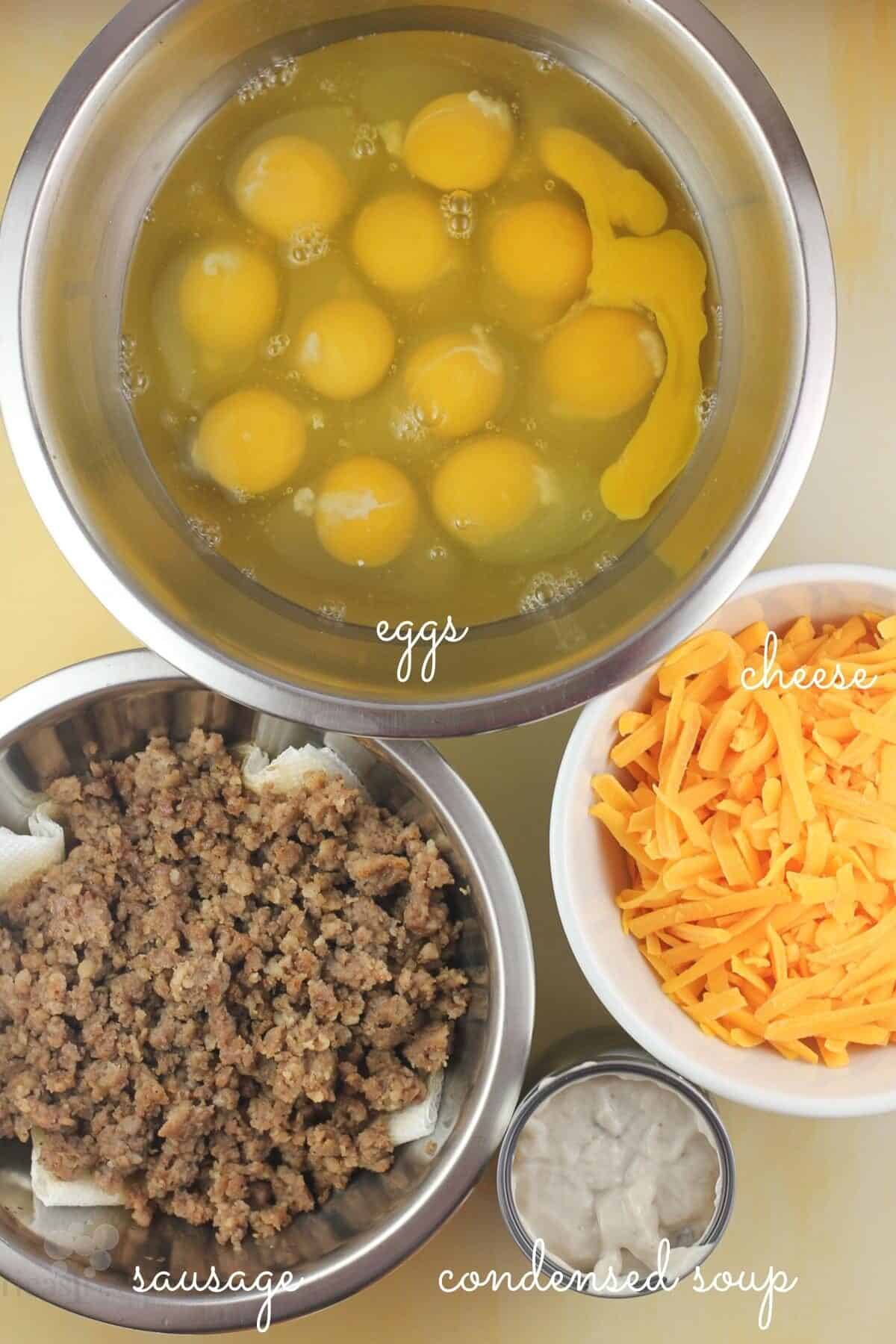 3 bowls and a can with the ingredients labelled: eggs, cheese, sausage, condensed soup