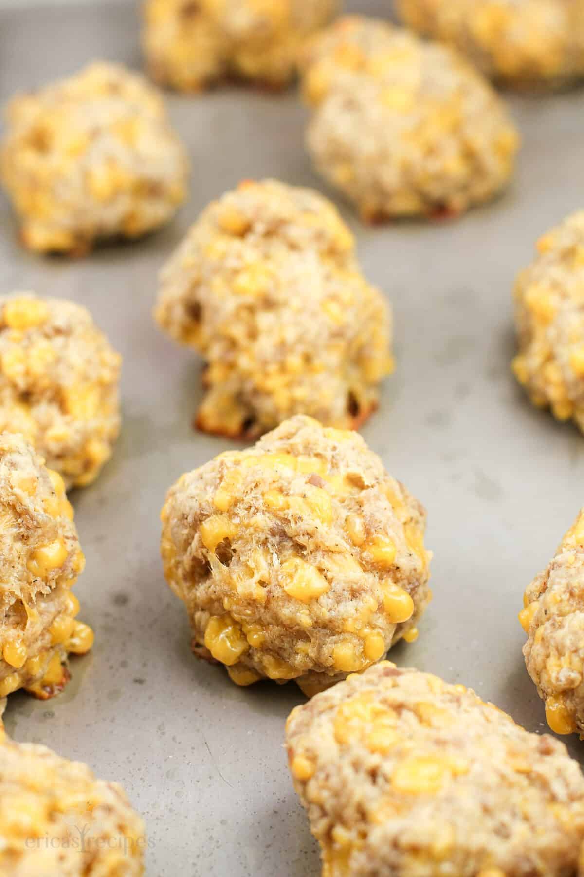 cooked sausage balls on bake sheet