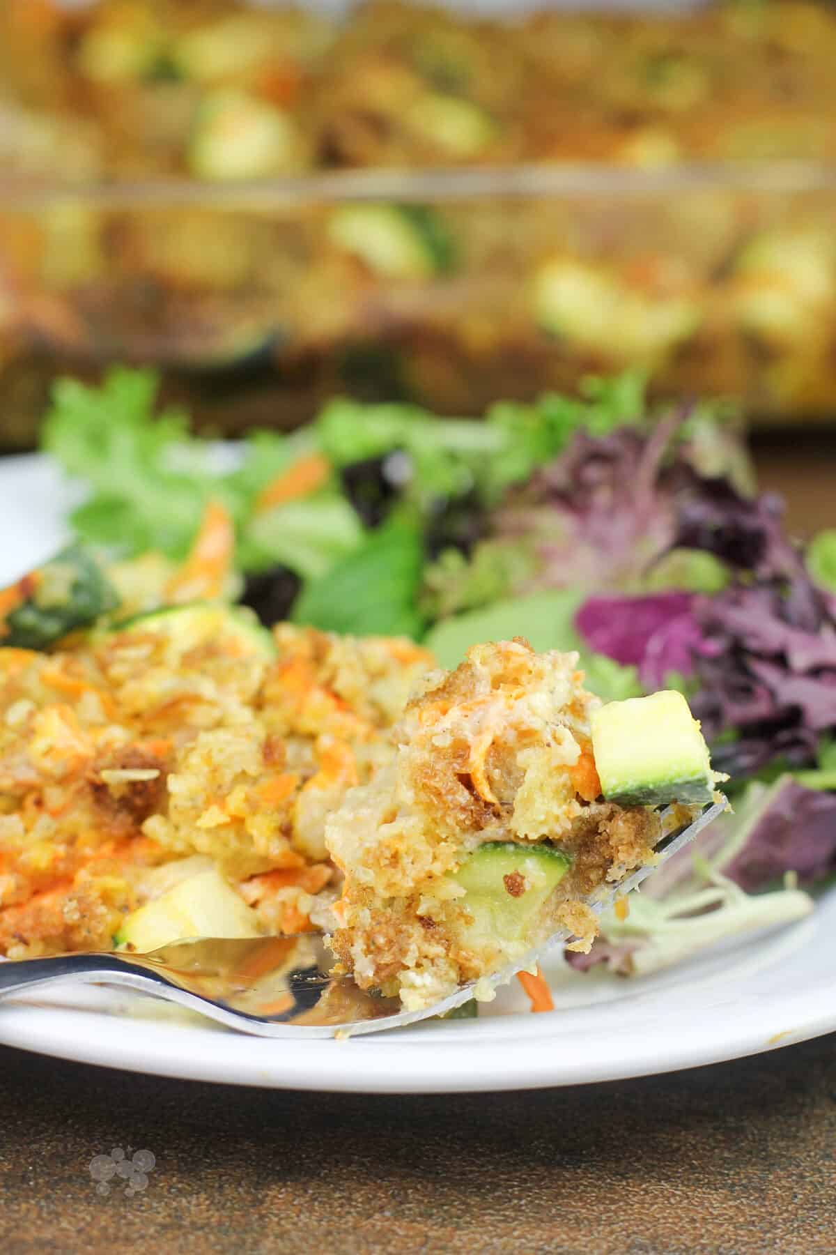 fork holding stuffing and zucchini
