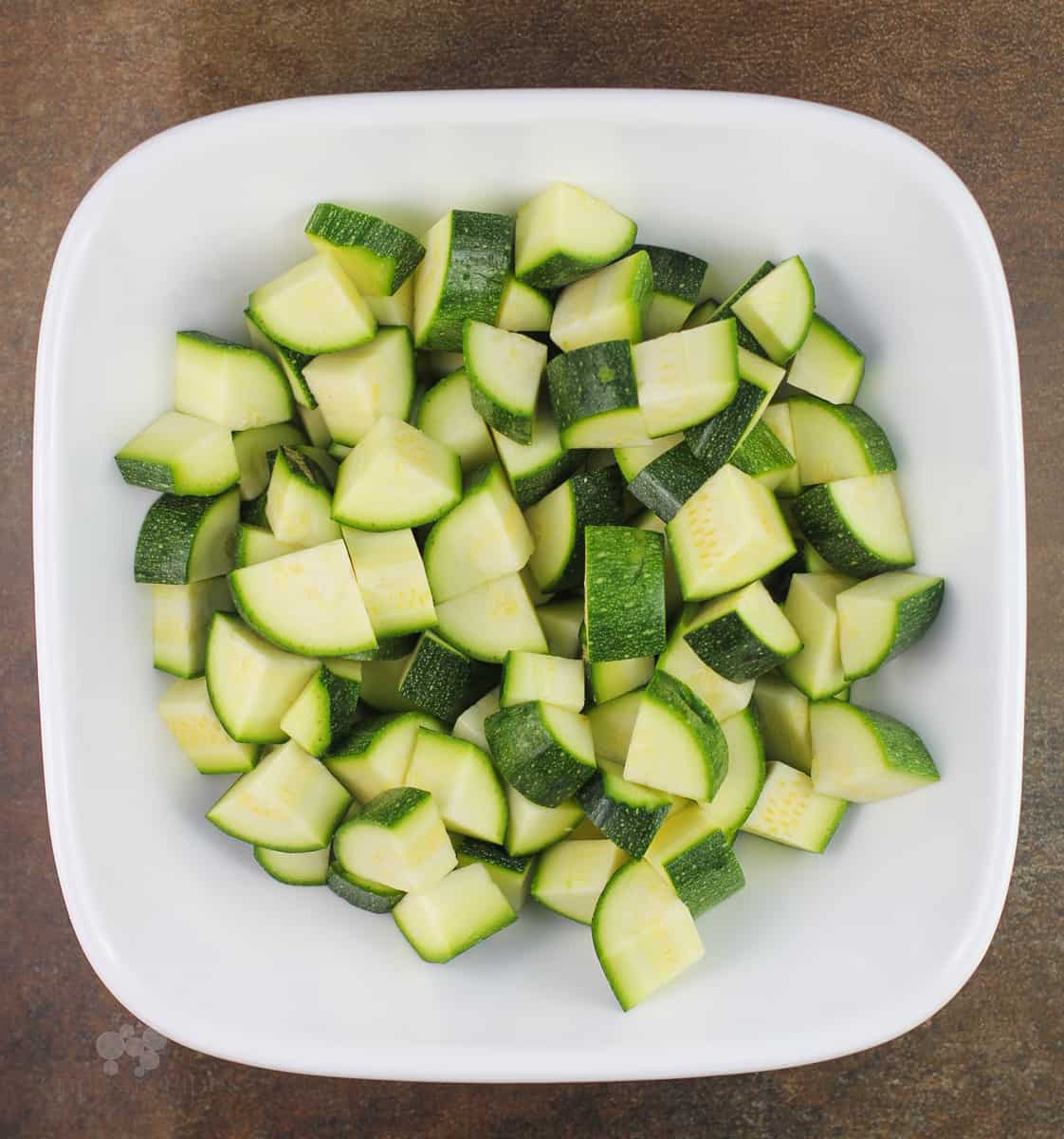 cut up zucchini in white bowl