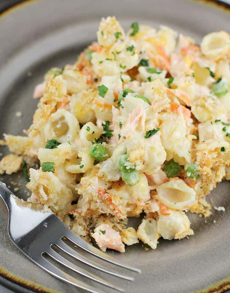 top angle, cooked fresh salmon casserole on a serving dish with a fork