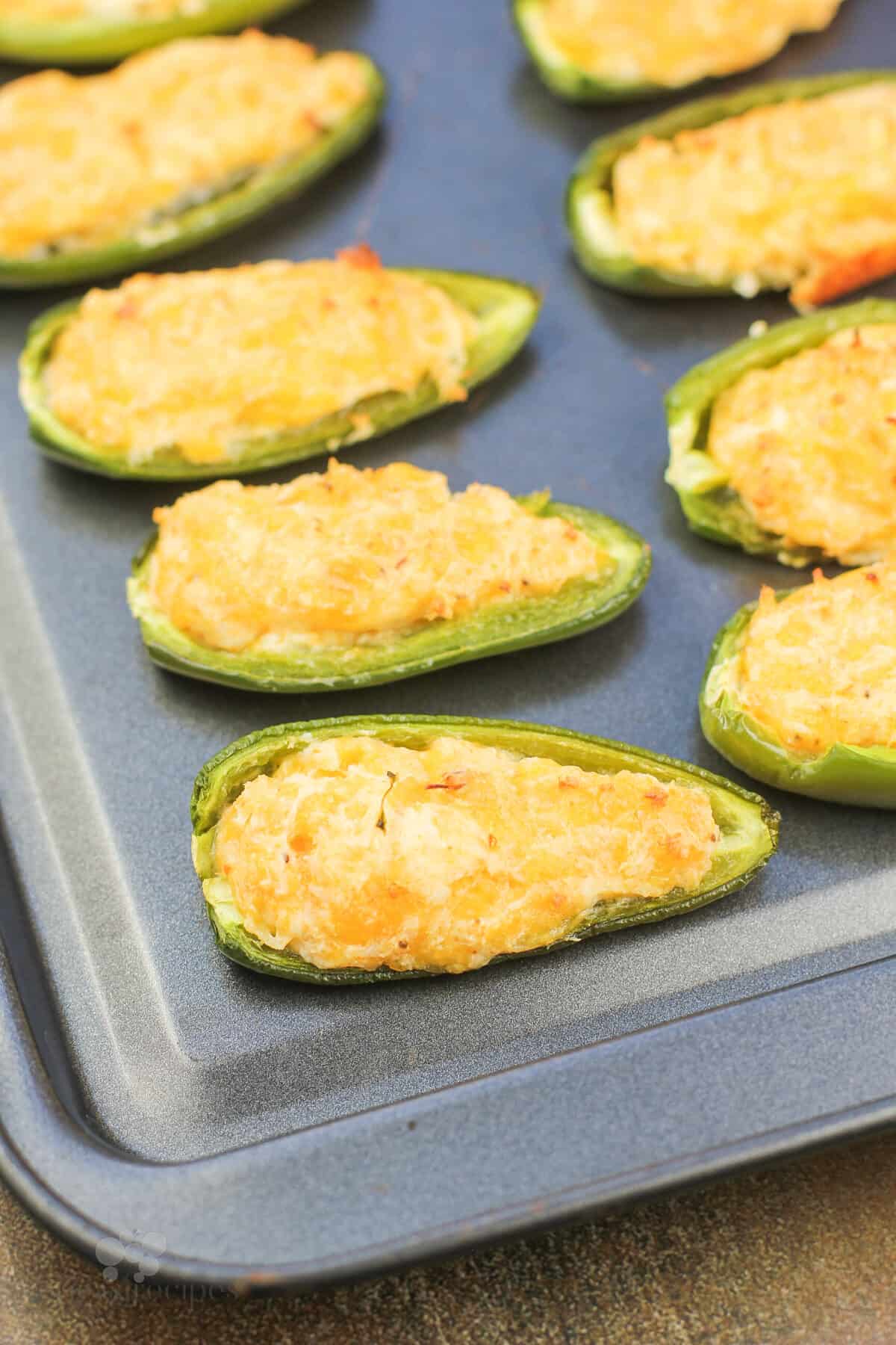 cooked shrimp jalapeno poppers on bake sheet