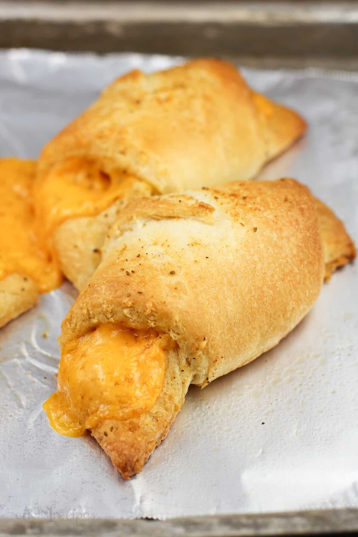 cooked rolls on bake sheet