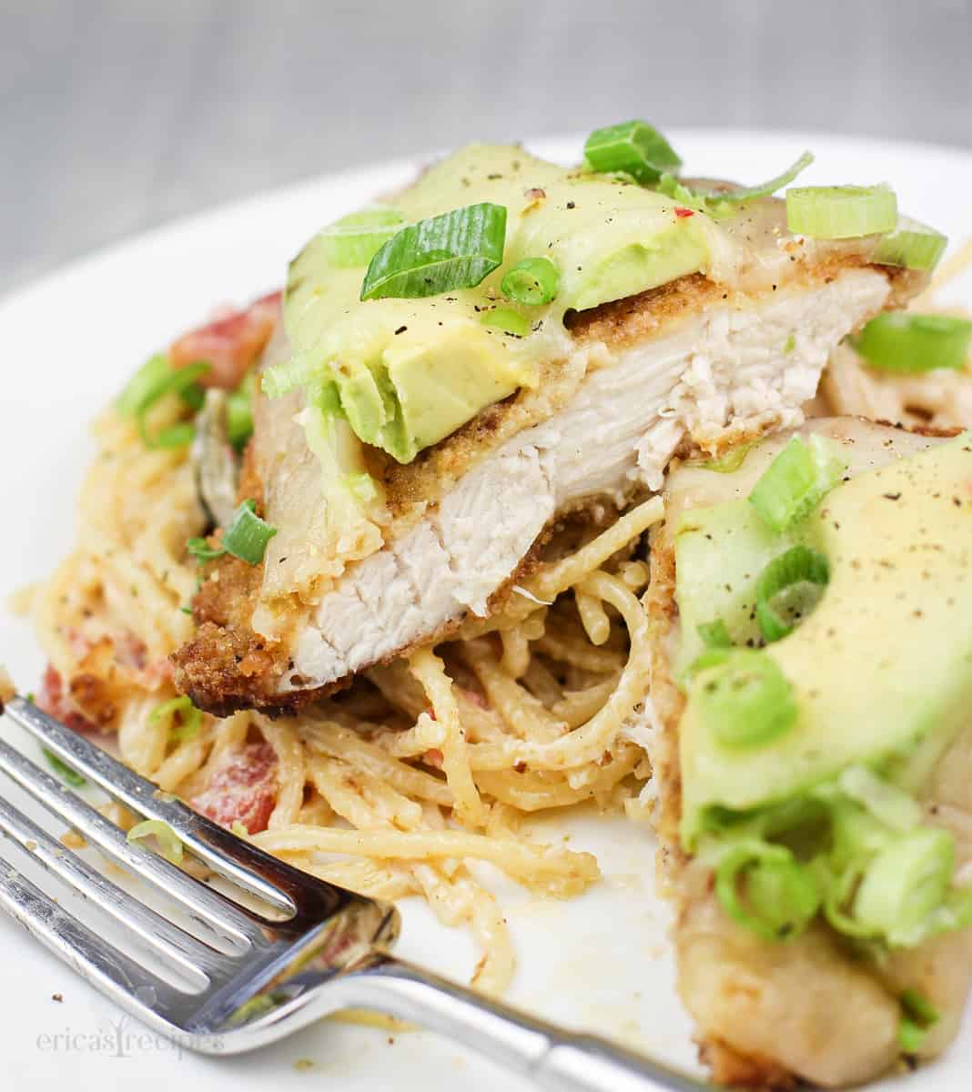 prepared recipe on plate, chicken cut to show doneness