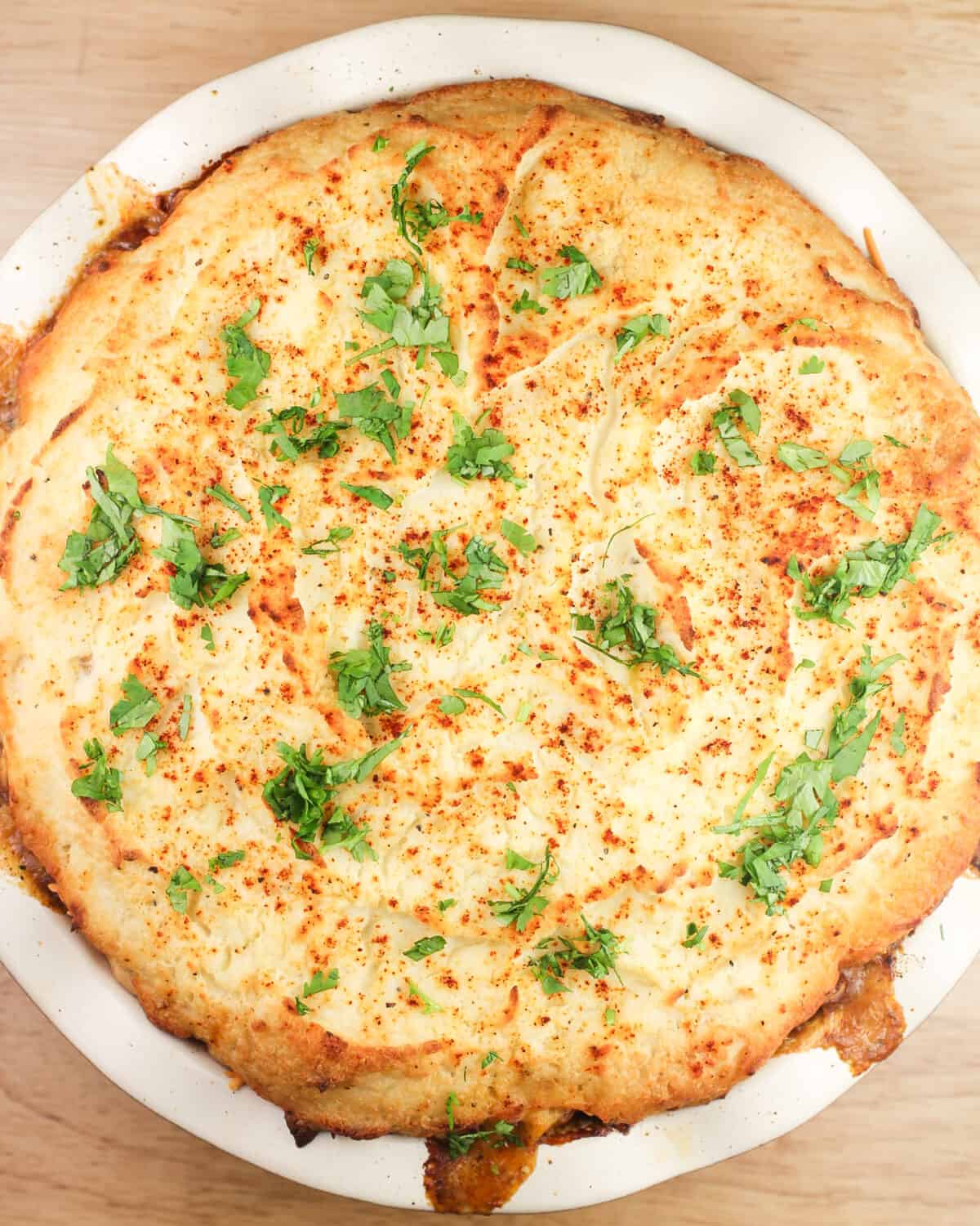 cooked shepherd's pie in pie plate, top down view