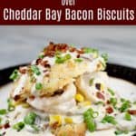 image for pinterest of finished recipe with text overlay Shrimp Gravy over Cheddar Bay Bacon Biscuits