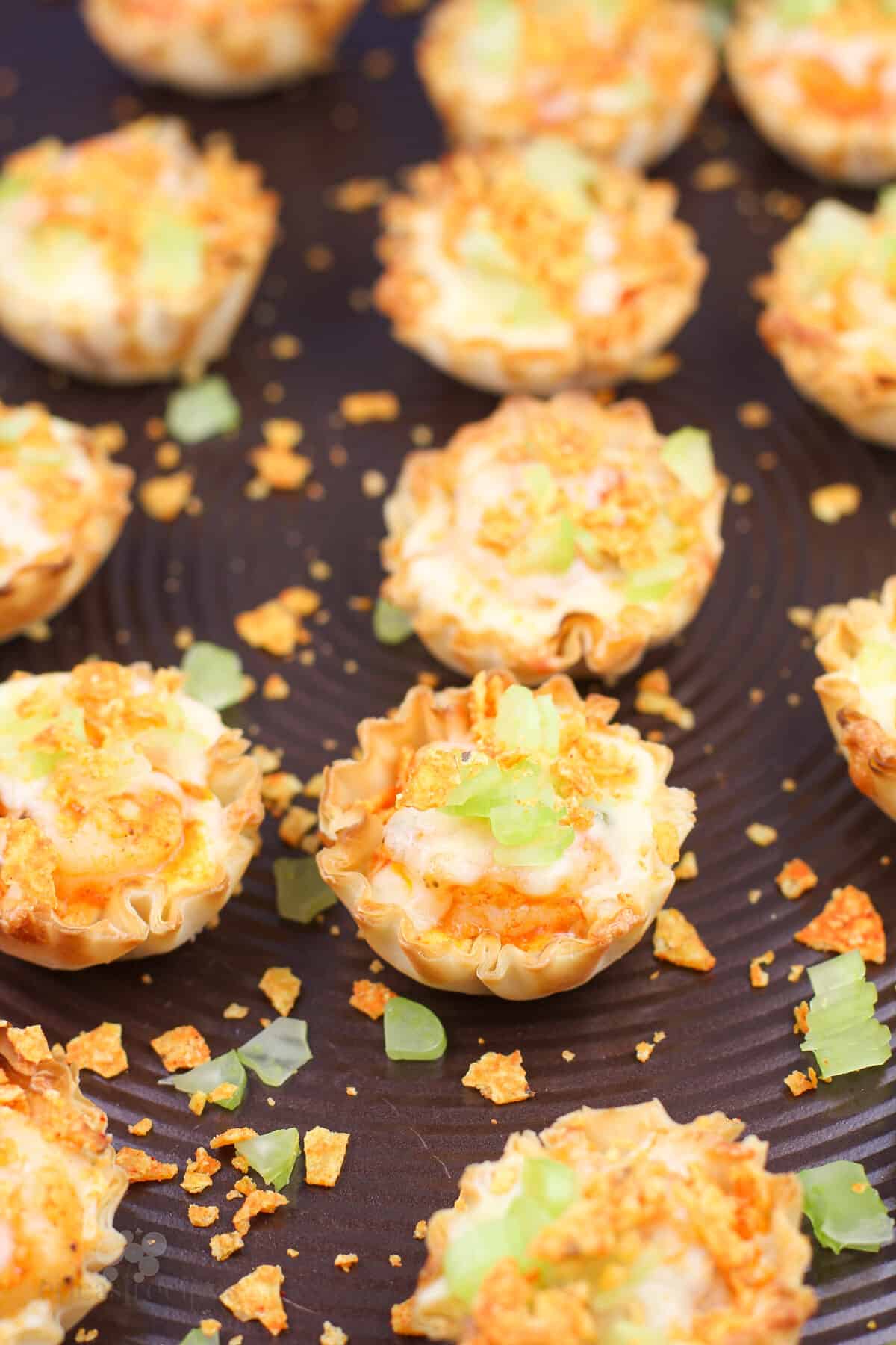 filled mini phyllo cups on bake sheet
