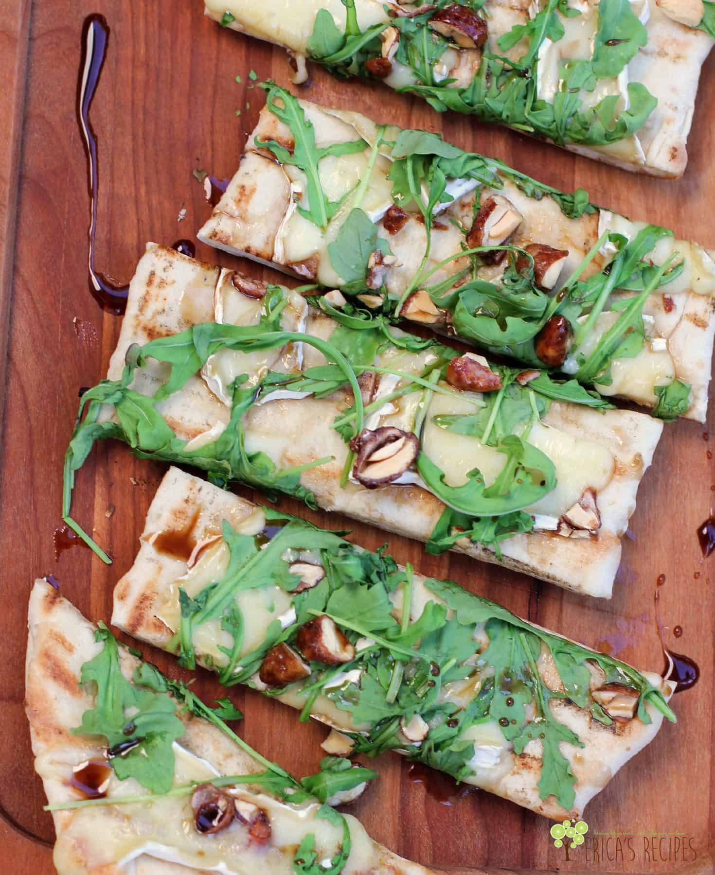 Grilled Flatbread with Brie, Arugula, Candied Nuts, and Balsamic-Honey Drizzle