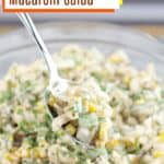 pin image with text Cajun Maque Choux Macaroni Salad