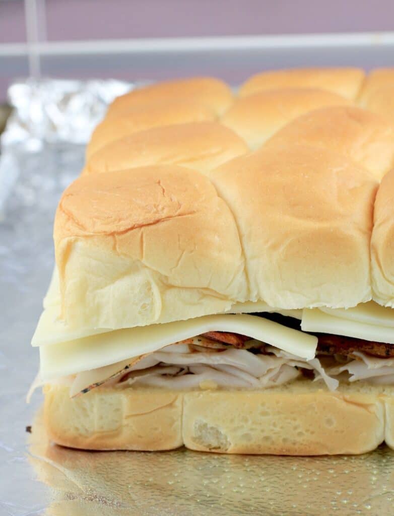 side view of the fully assembled turkey sliders on Hawaiian rollssliders
