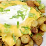 image for sharing on pinterest with text overlay Cheesy Fiesta Potatoes Taco Bell copycat recipe