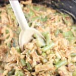image for sharing on social media with spoon lifting casserole; text overly of recipe title