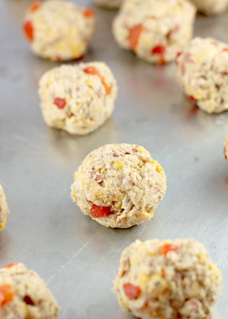 prepared sausage balls on bake sheet, uncooked