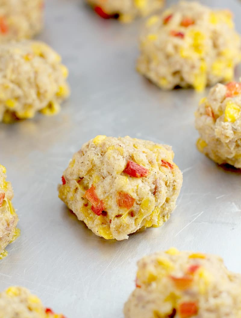 cooked sausage ball on a metal bake sheet