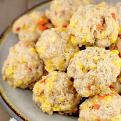 balls of sausage stacked on a grey plate