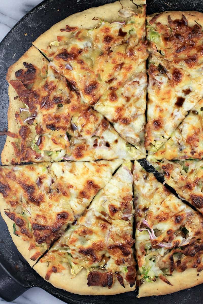 top down view of whole pizza, sliced