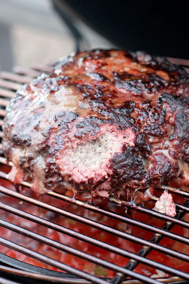 smoked ground beef with piece removed to show internal smoke ring