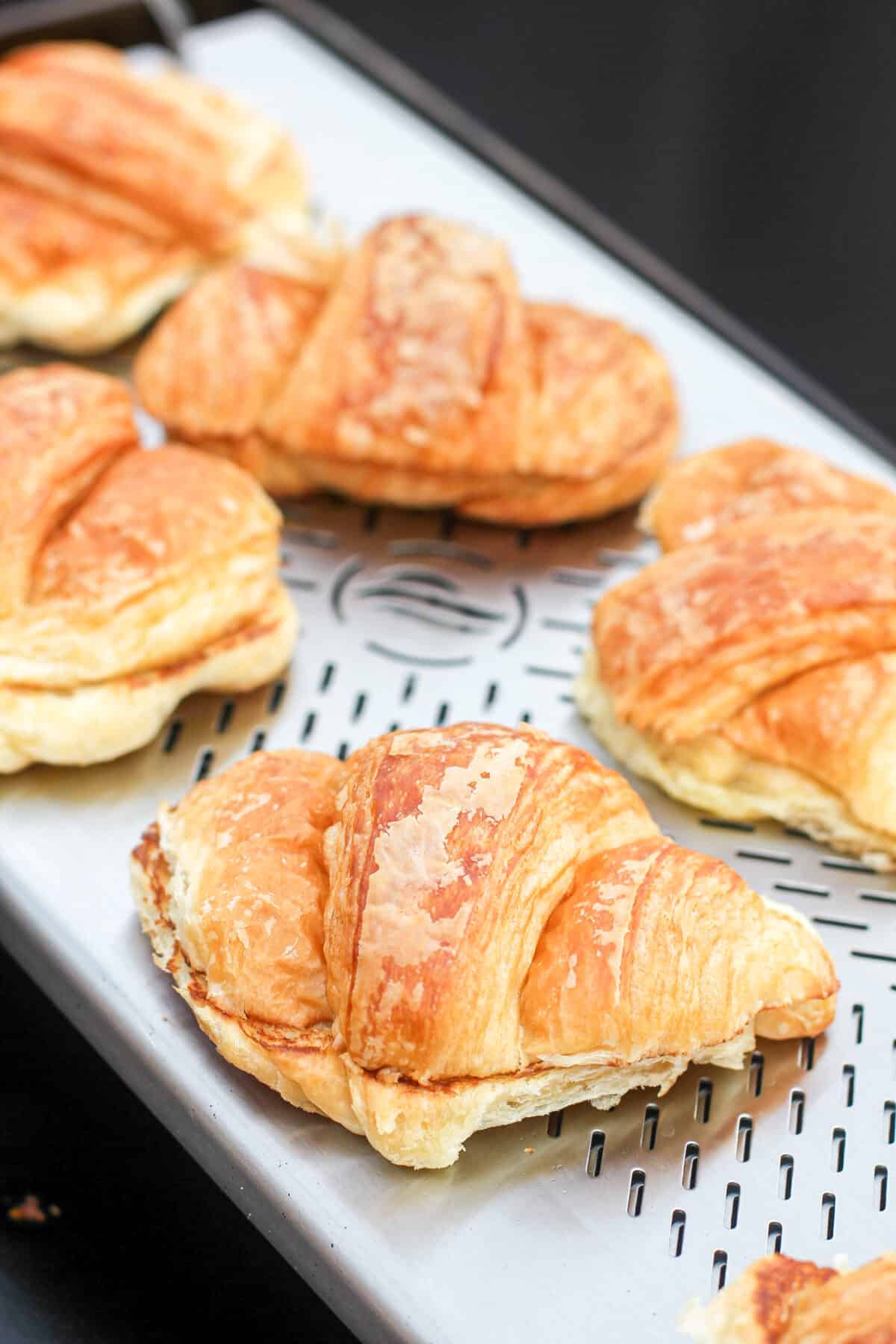 close view of croissants sitting on Blackstone warmer rack