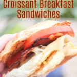 image of prepared recipe for Pinterest with text overlay recipe title Blackstone Croissant Breakfast Sandwiches