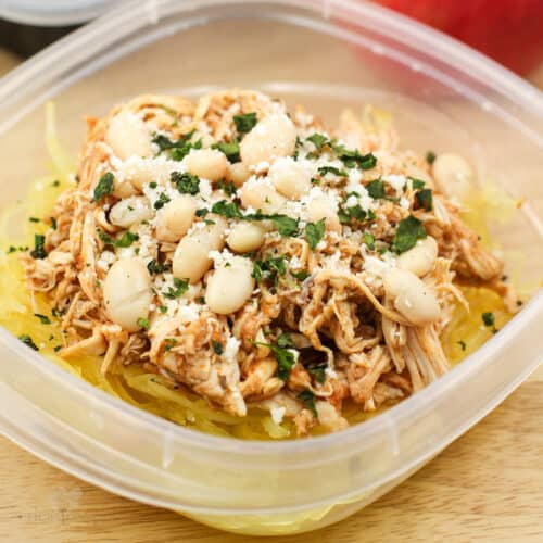 chicken pizzaiola in plastic container topped with white beans