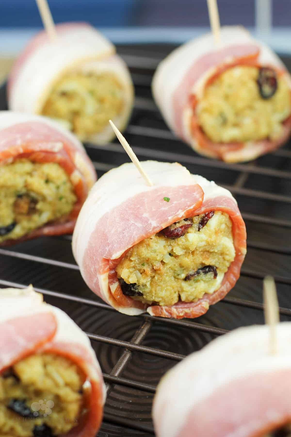 uncooked ball of stuffing wrapped with bacon
