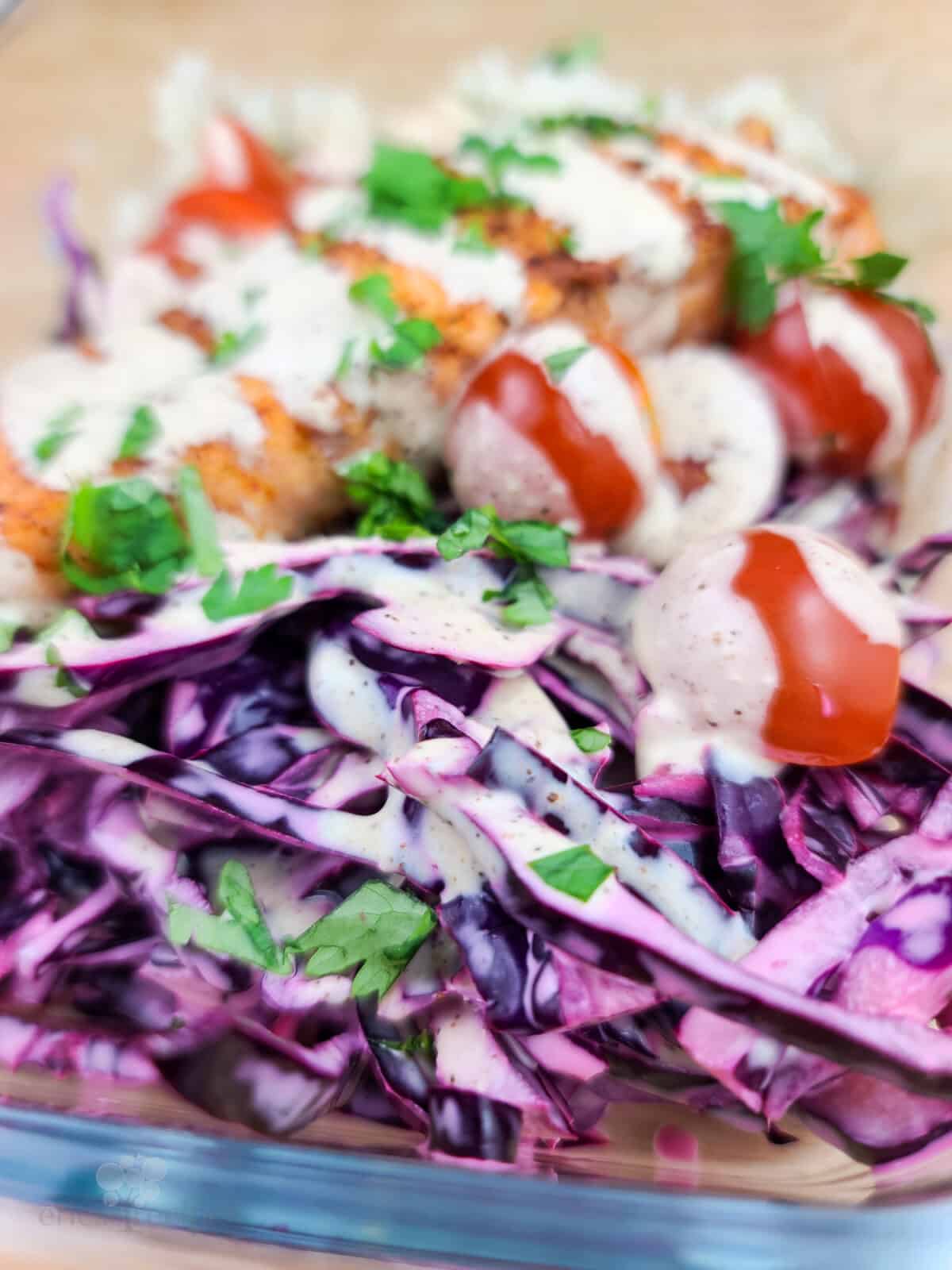 purple cabbage with creamy chipotle dressing spooned over