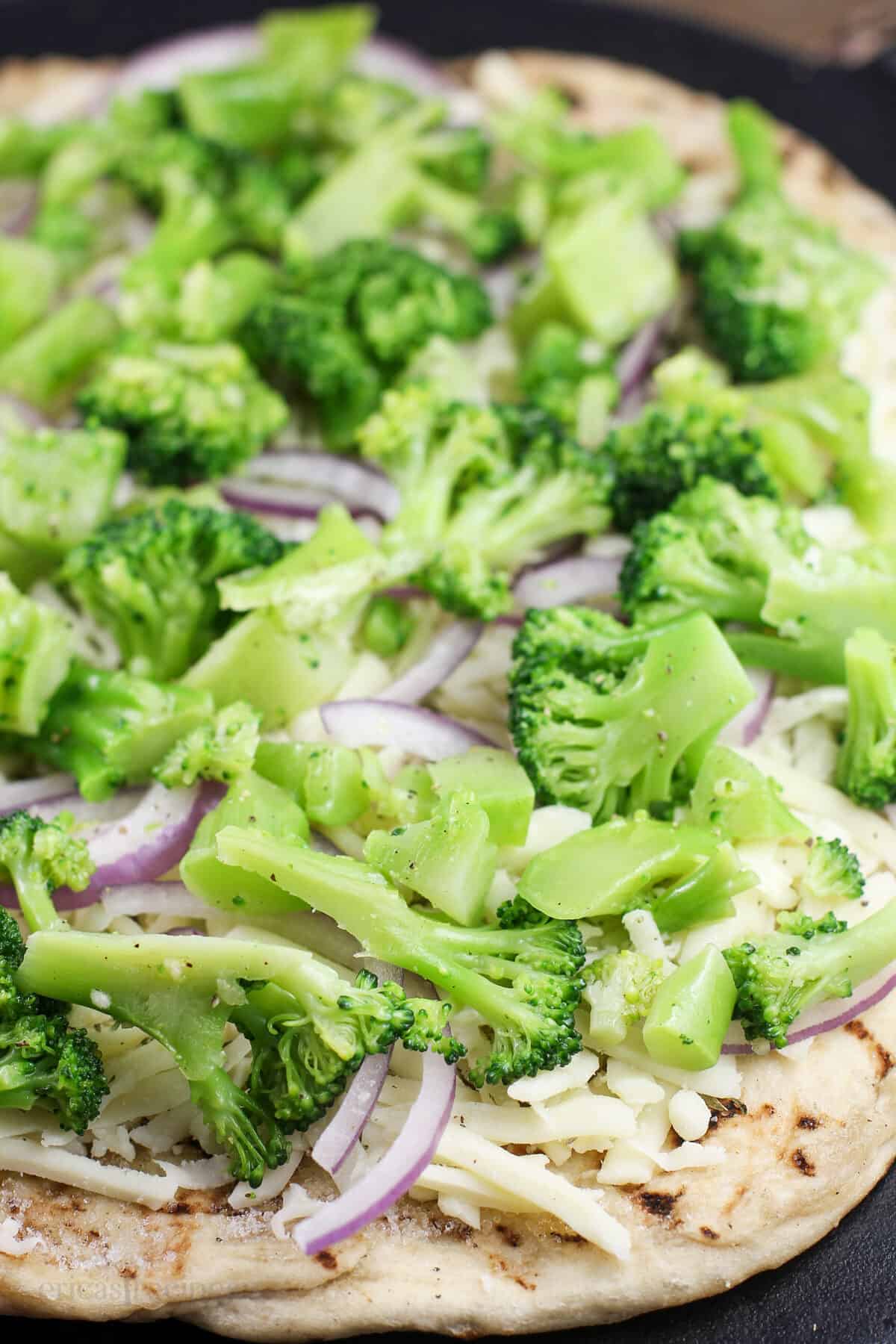 assembled pizza prior to cooking to show ingredients