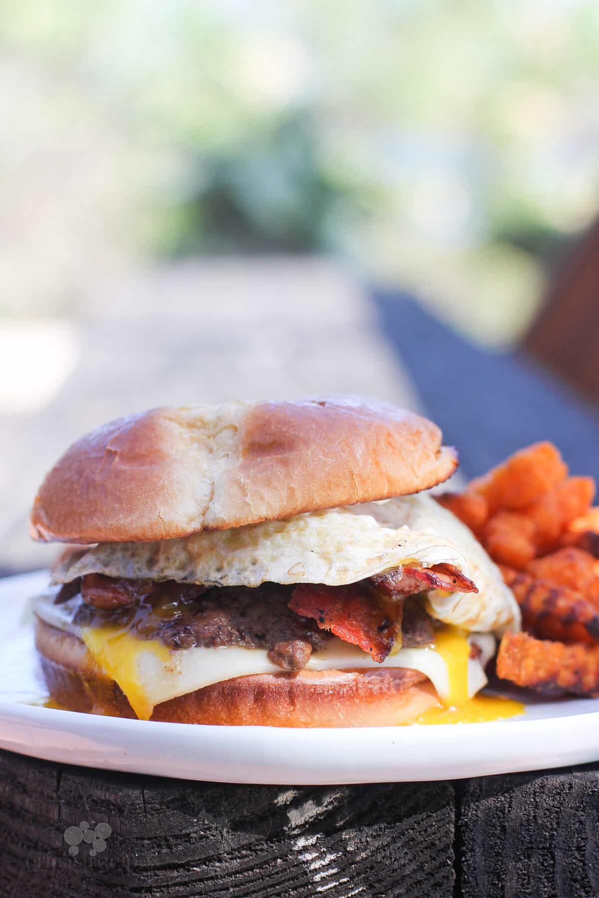 prepared breakfast smashed burger on white plate