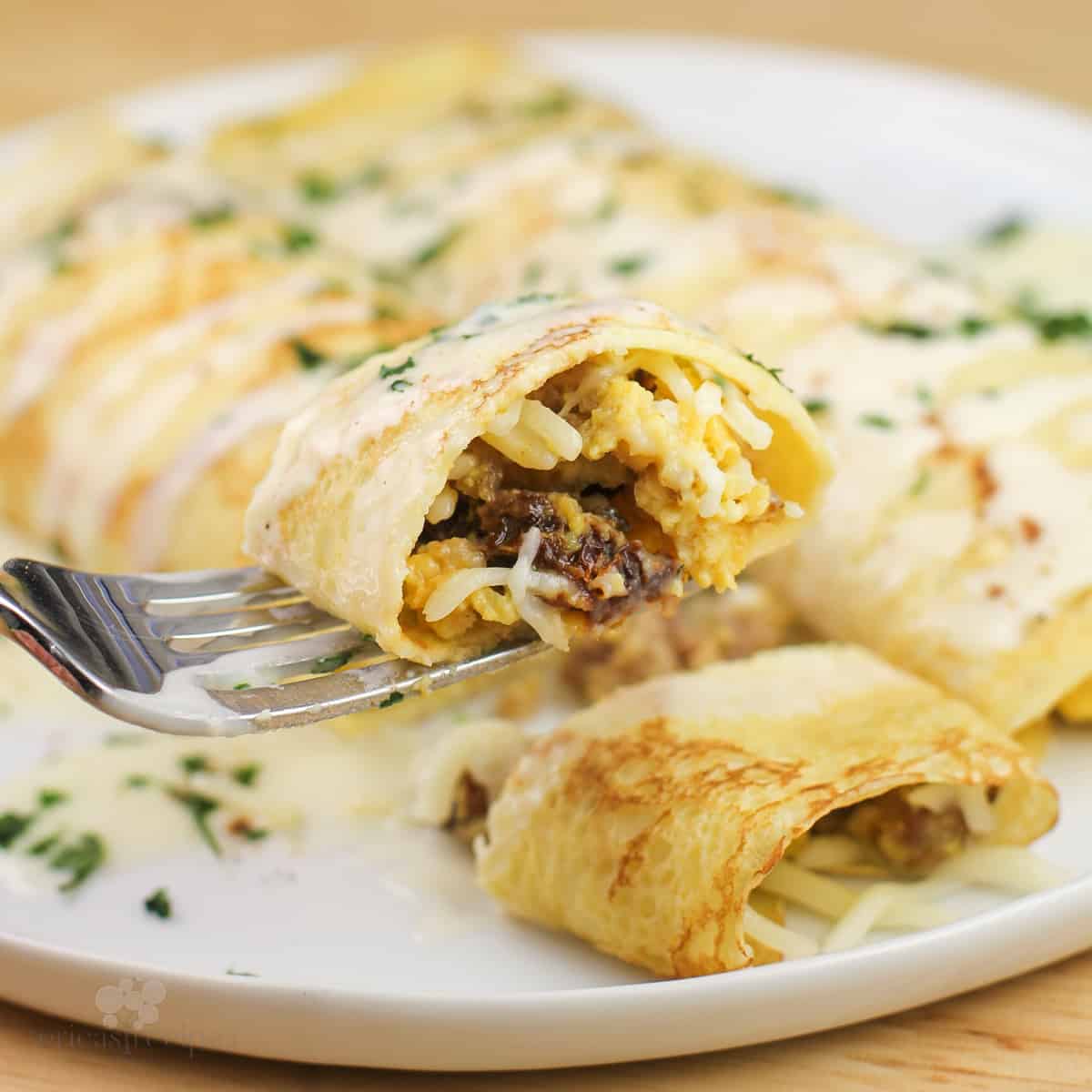 piece of prepared recipe on fork over white plate