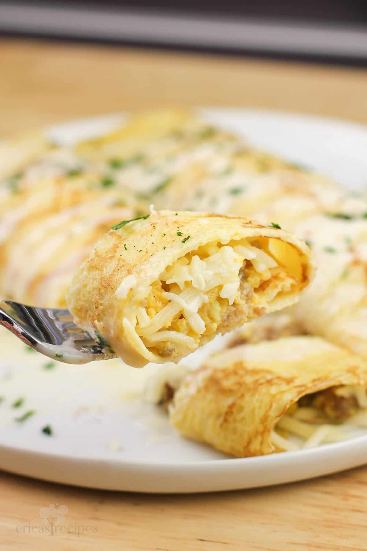 piece of prepared recipe on fork over white plate