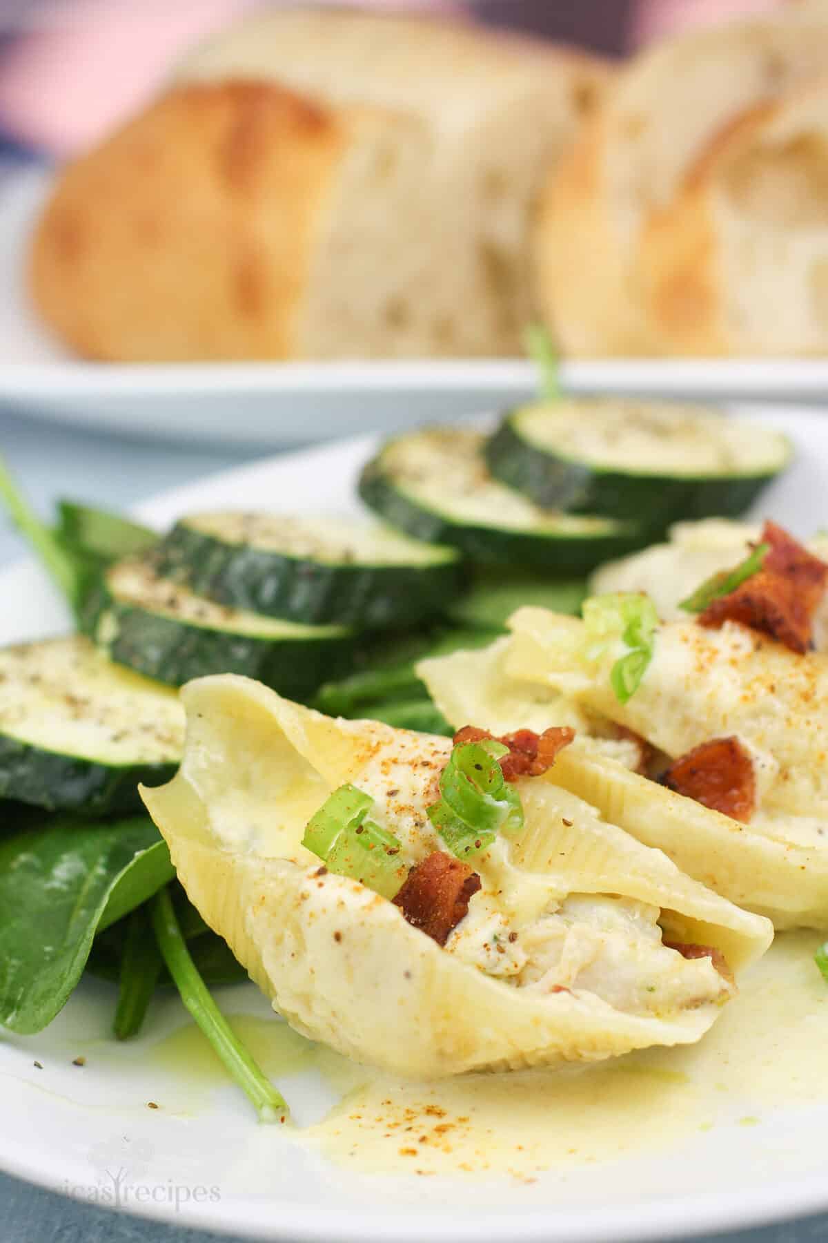 plated portion of shells stuffed with crab with salad