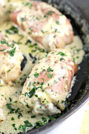 prosciutto wrapped chicken in cast iron skillet