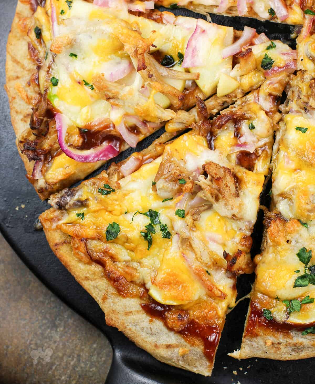 slice of pizza on black pizza stone.