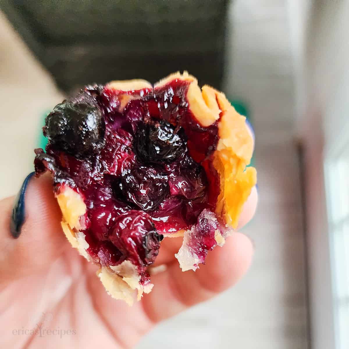 hand holding a prepared pie bite