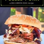 image for pinterest with text overlay juicy smoked pulled pork (a big green egg recipe)
