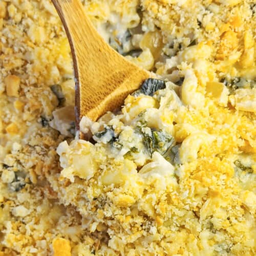 wood spoon inserted into poblano mac and cheese