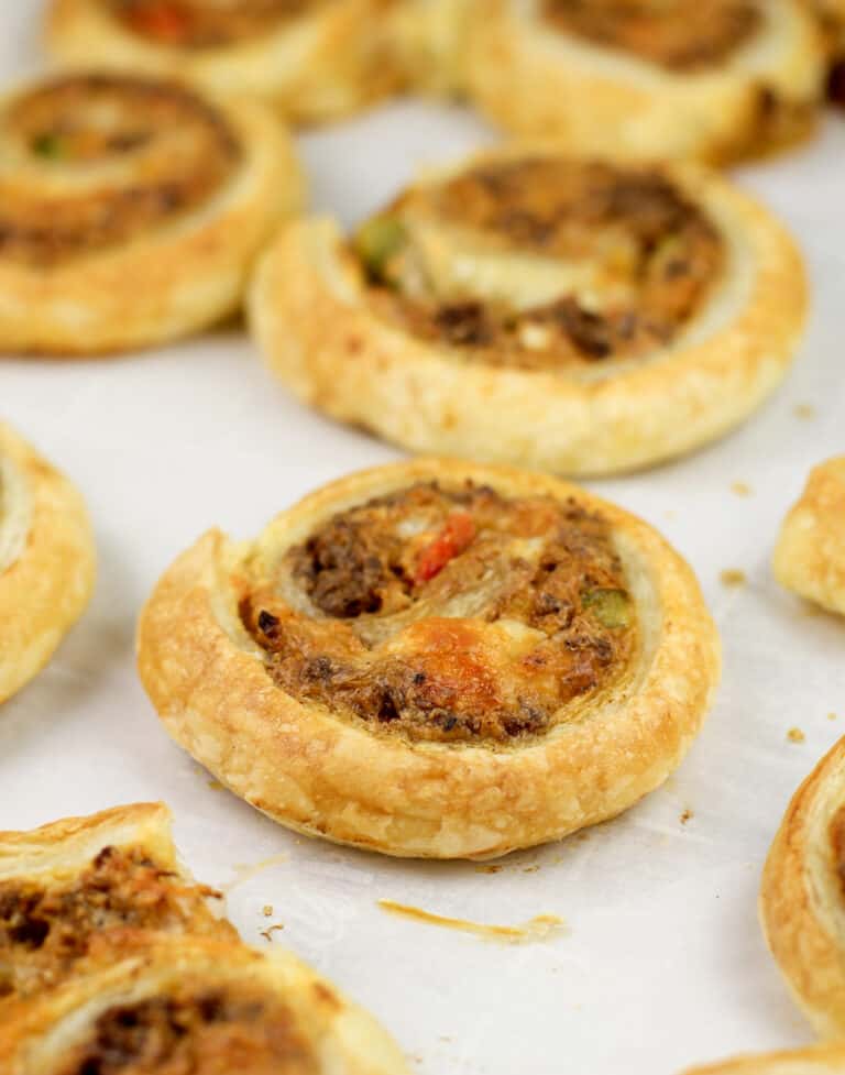 cooked puff pastry taco pinwheels on parchment paper