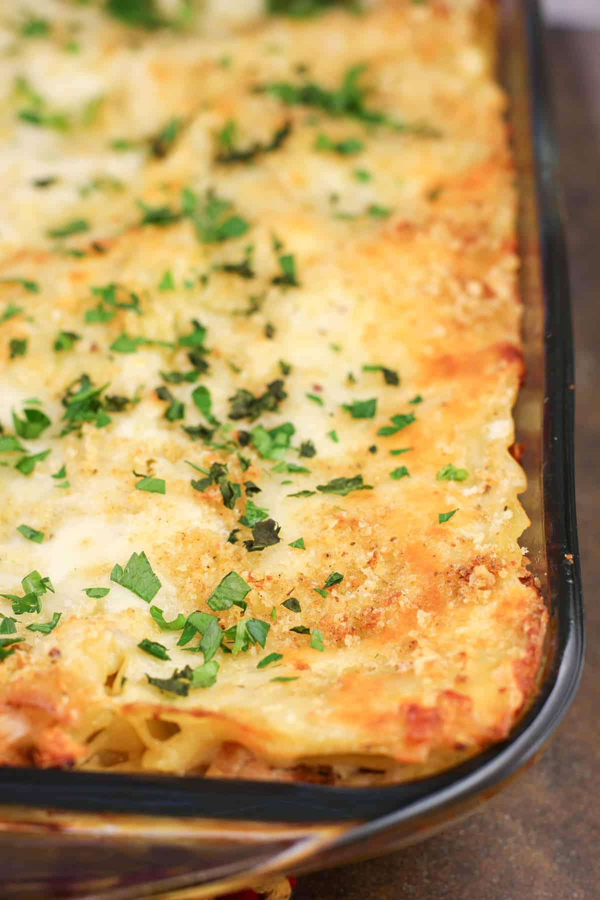 cooked lasagna in glass bake dish