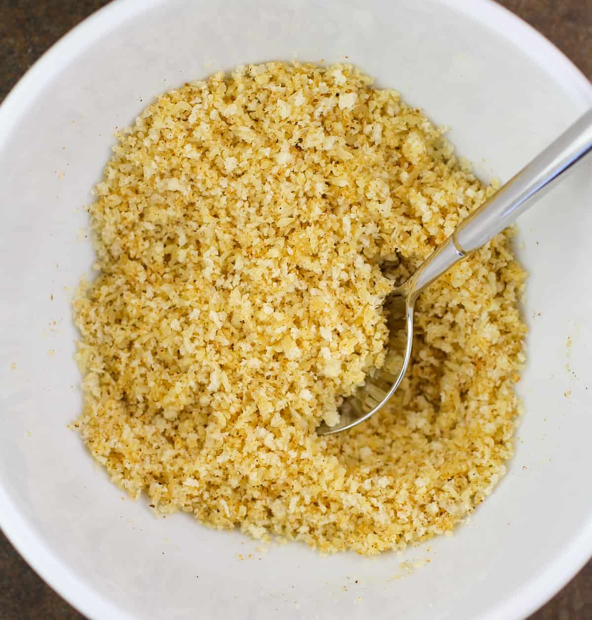 prepared panko topping in white bowl with spoon