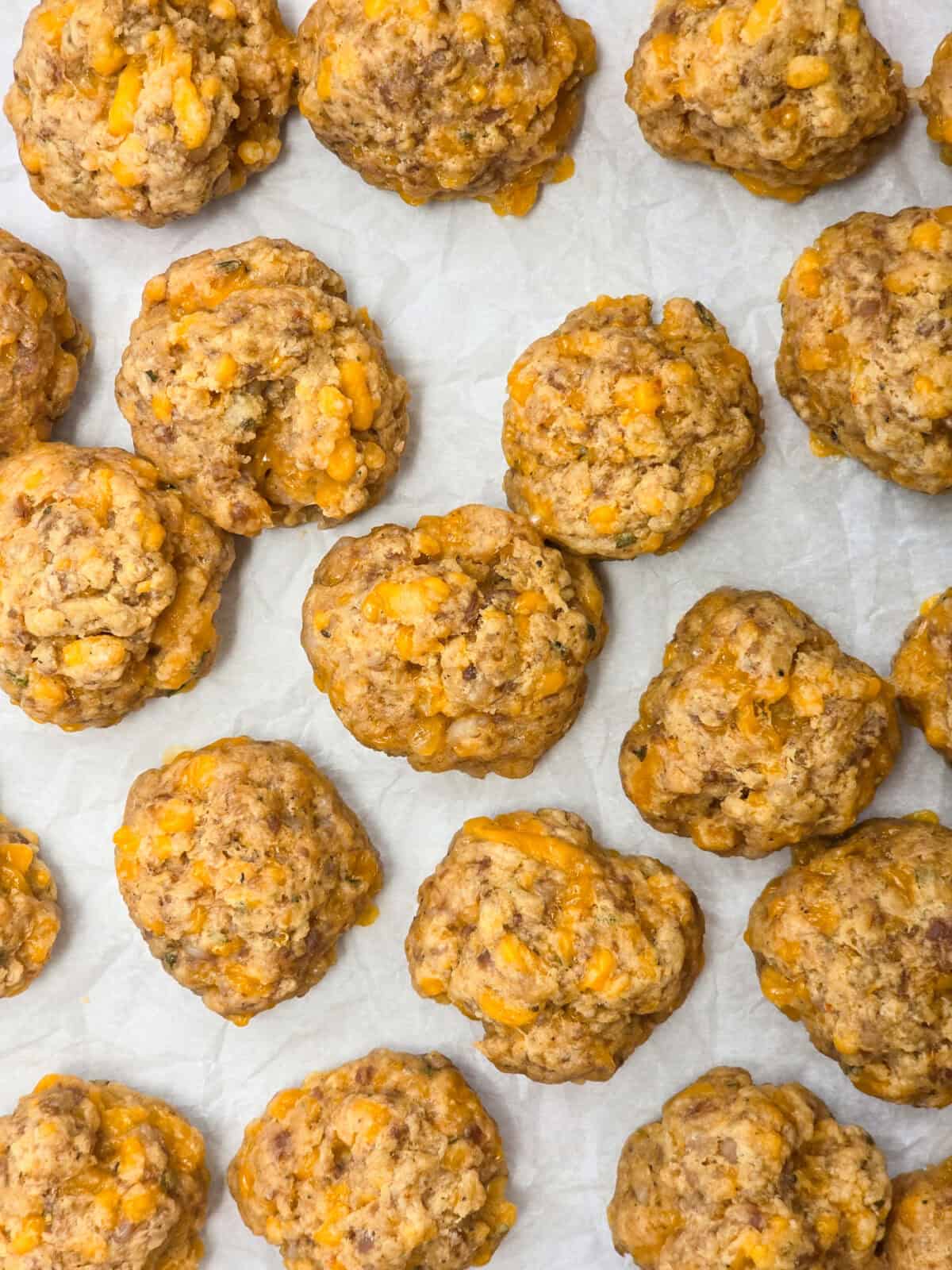 cooked sausage balls on parchment paper